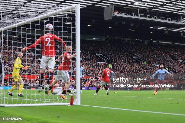Victor Lindelof of Manchester United clears off the line from Douglas Luiz of Aston Villa during the Premier League match between Manchester United...