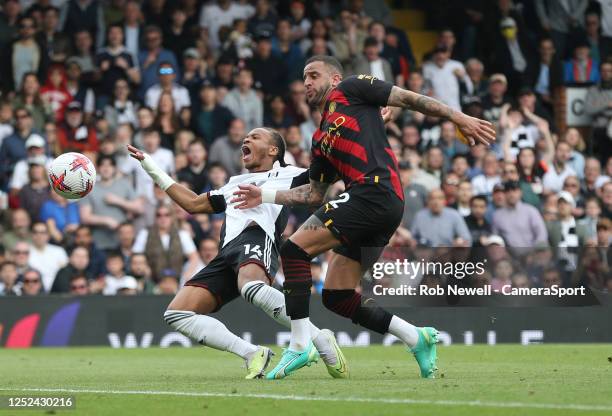 Fulham's Bobby Reid goes down under pressure from Manchester City's Kyle Walker but no penalty was awarded during the Premier League match between...