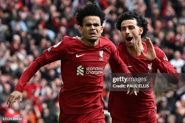 Liverpool's Colombian midfielder Luis Diaz celebrates with Liverpool's English midfielder Curtis Jones after scoring their second goal during the...