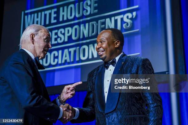 President Joe Biden, left, shakes hands with comedian Roy Wood Jr. During the White House Correspondents' Association dinner in Washington, DC, US,...