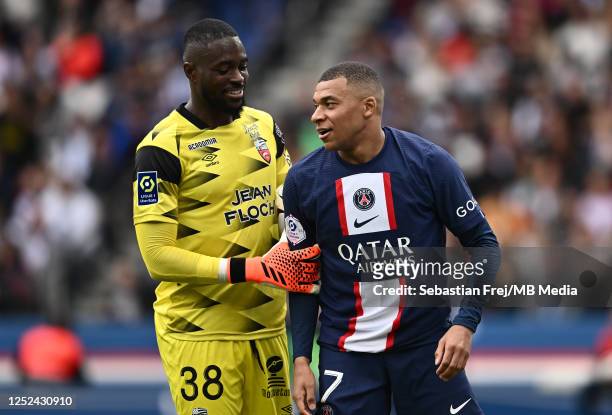Kylian Mbappe of Paris Saint-Germain and goalkeeper Yvon Mvogo of FC Lorient during the Ligue 1 match between Paris Saint-Germain and FC Lorient at...