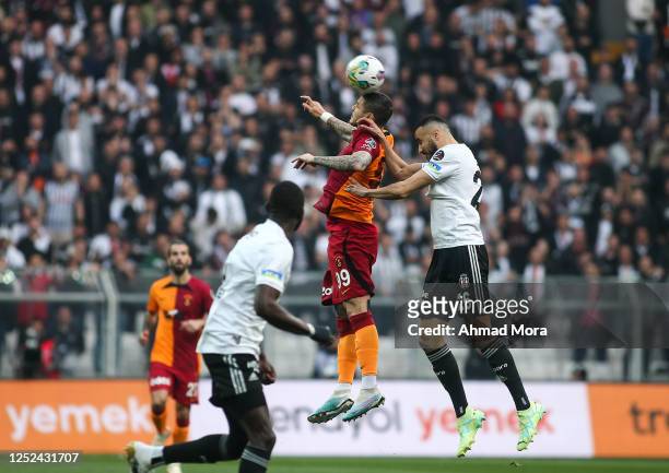 Mauro Icardi of Galatasaray jumps for the ball with Romain Saiss of News  Photo - Getty Images