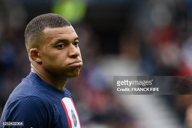 Paris Saint-Germain's French forward Kylian Mbappe reacts during the French L1 football match between Paris Saint-Germain and FC Lorient at The Parc...