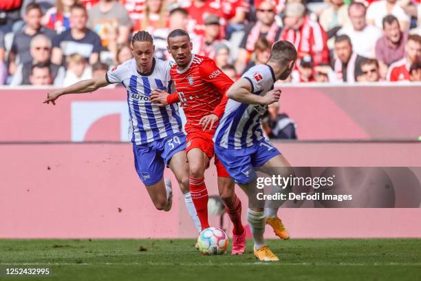 Derry Scherhant of Hertha BSC, Leroy Sane of Bayern Muenchen and Jonjoe Kenny of Hertha BSC battle for the ball during the Bundesliga match between...