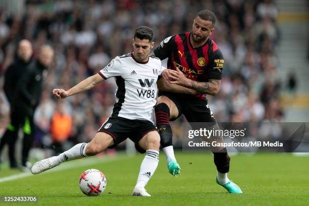 Manor Solomon of Fulham is challenged by Kyle Walker of Manchester City during the Premier League match between Fulham FC and Manchester City at...