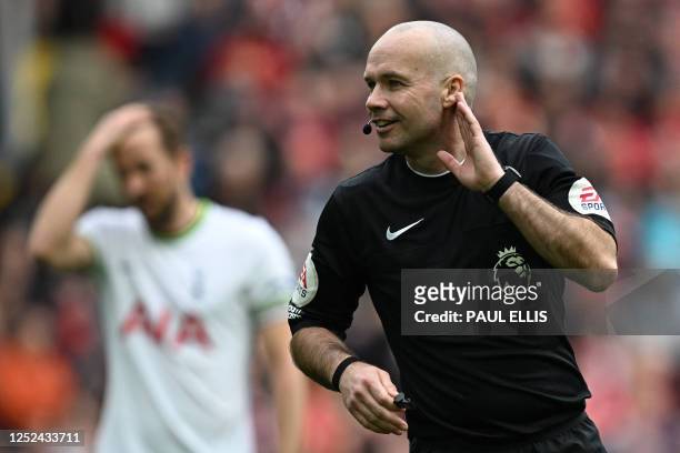 English referee Paul Tierney gestures during the English Premier League football match between Liverpool and Tottenham Hotspur at Anfield in...