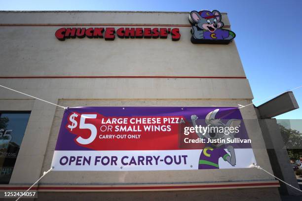 Sign is posted on the exterior of a Chuck E. Cheese's restaurant on June 25, 2020 in Pinole, California. CEC Entertainment, the parent company of...