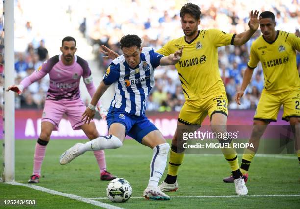 Porto's Brazilian forward Pepe Cossa fights for the ball with Boavista's French defender Vincent Sasso during the Portuguese league football match...