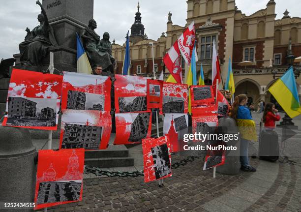 On the 430th day of the Russian invasion of Ukraine, Ukrainian activists in Krakow hold an impactful outdoor personal photo exposition titled 'Bloody...