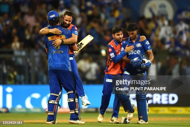 Mumbai Indians' players celebrate their win at the end of the Indian Premier League Twenty20 cricket match between Mumbai Indians and Rajasthan...