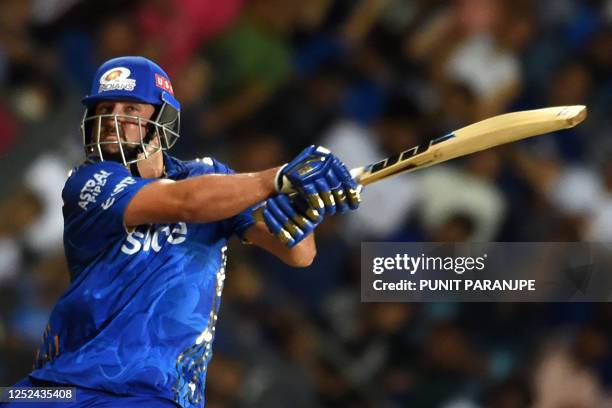 Mumbai Indians' Tim David plays a shot during the Indian Premier League Twenty20 cricket match between Mumbai Indians and Rajasthan Royals at the...