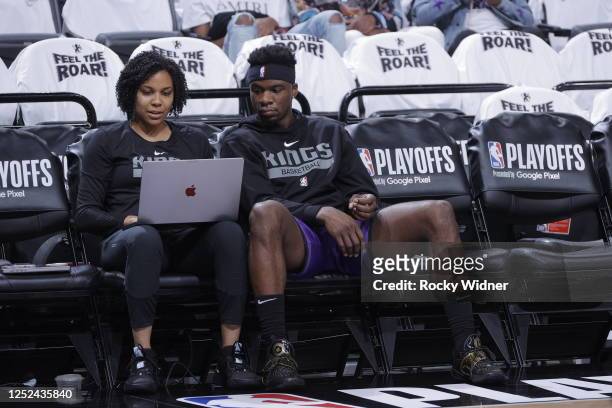 Terence Davis II of the Sacramento Kings reviews film with Assistant Coach Lindsey Harding during Round One Game Seven of the 2023 NBA Playoffs on...