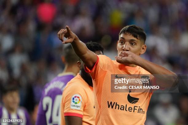 Atletico Madrid's Argentine defender Nahuel Molina celebrates after scoring his team's first goal during the Spanish league football match between...
