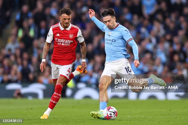 Ben White of Arsenal and Jack Grealish of Manchester City during the Premier League match between Manchester City and Arsenal FC at Etihad Stadium on...