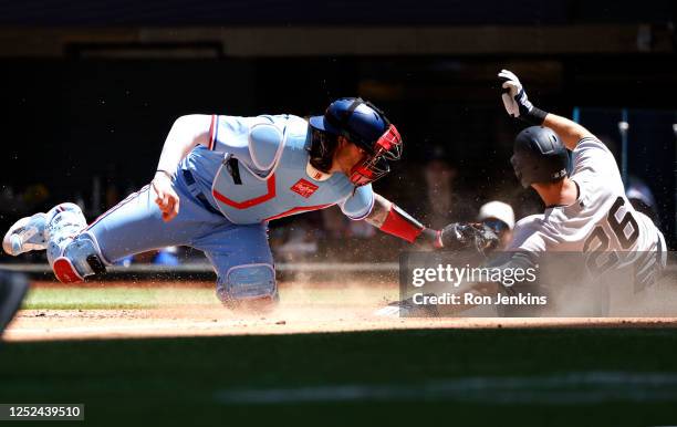 LeMahieu of the New York Yankees is tagged out at home plate by Jonah Heim of the Texas Rangers during the fourth inning at Globe Life Field on April...