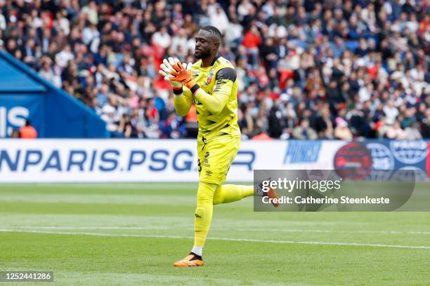 Yvon Mvogo of FC Lorient reacts to a play during the Ligue 1 match between Paris Saint-Germain and FC Lorient at Parc des Princes on April 30, 2023...