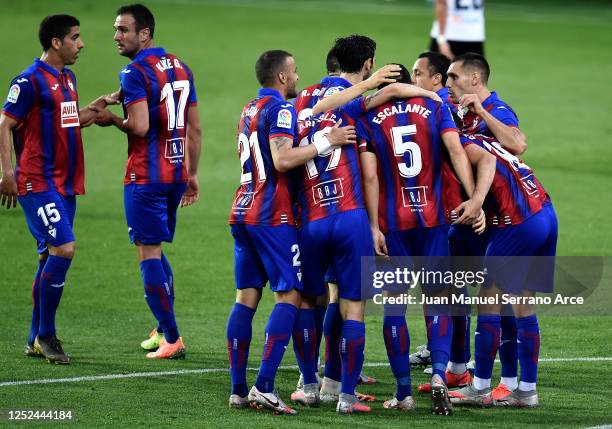 Players of of SD Eibar celebrate the first goal of the game, an own goal scored by Geoffrey Kondogbia of Valencia CF during the Liga match between SD...