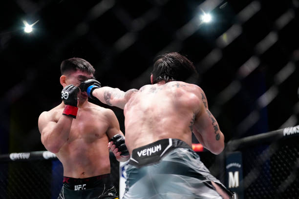 Ricky Simon punches Song Yadong fight in a Bantamweight bout for UFC Fight Night on April 29 at UFC Apex in Las Vegas, NV.