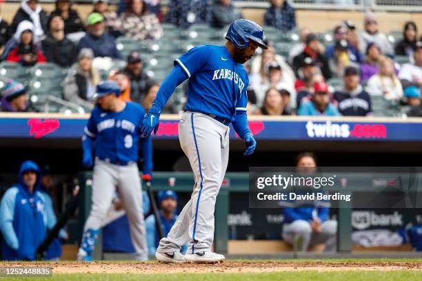 Jackie Bradley Jr. #41 of the Kansas City Royals scores a run on an error against the Minnesota Twins in the sixth inning at Target Field on April...