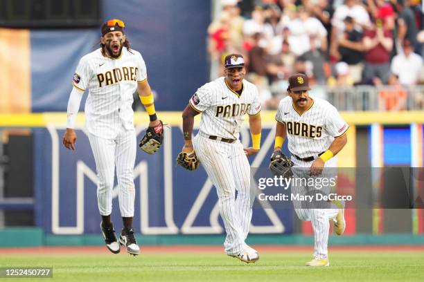 Fernando Tatis Jr. #23, Juan Soto and Trent Grisham of the San Diego Padres celebrate winning the game between the San Francisco Giants and the San...