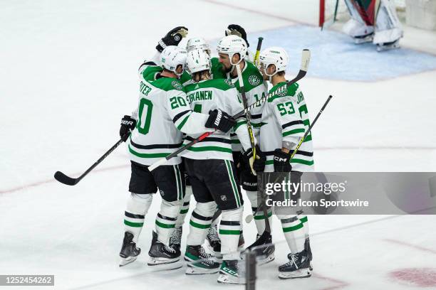 Dallas Stars center Wyatt Johnston celebrates with teammates after a goal during Game Six of the First Round of the 2023 Stanley Cup Playoffs between...