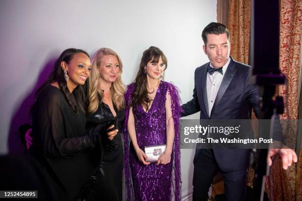 Guests including Zooey Deschanel and Jonathan Scott, enjoy a selfie booth at CBS News' White House correspondents' dinner after-party hosted at the...