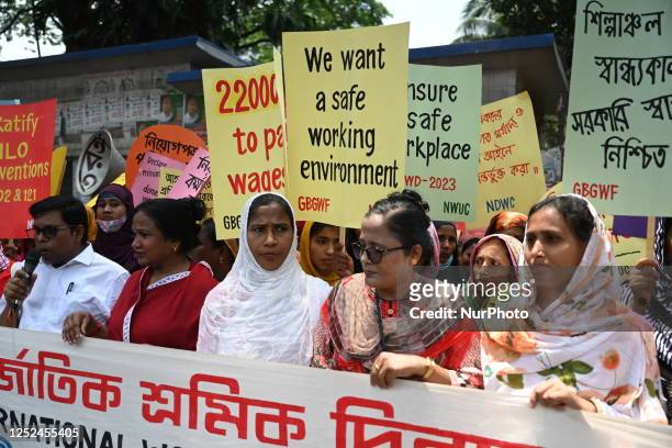 Bangladeshi garment workers and other labor organization activists take part in a rally to mark May Day or International Workers' Day in Dhaka,...