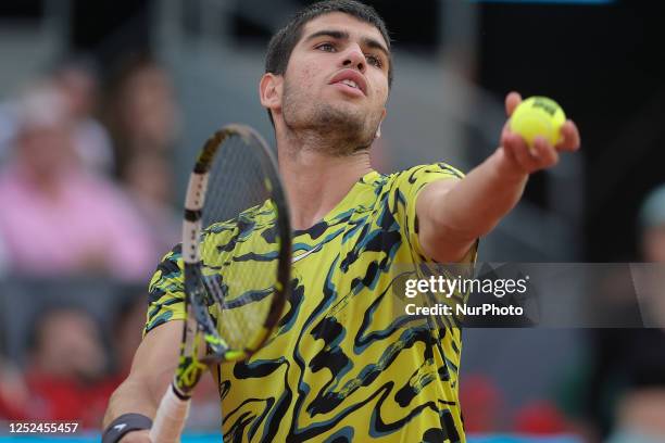 Carlos Alcaraz of Spain against Grigor Dimitrov of Bulgaria during their third round match on day seven of the Mutua Madrid Open at La Caja Magica on...