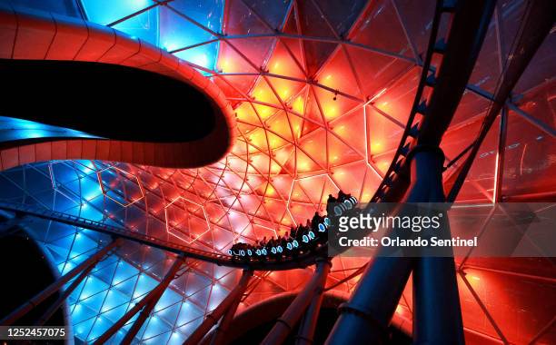 An array of colors flashes through the massive canopy at the new Tron Lightcycle / Run roller coaster during a preview for invited guests at the...