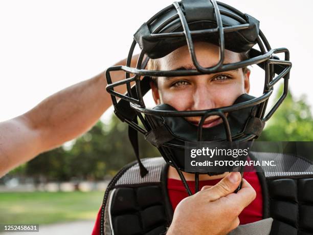 young catcher and the coach - baseball catcher stock pictures, royalty-free photos & images