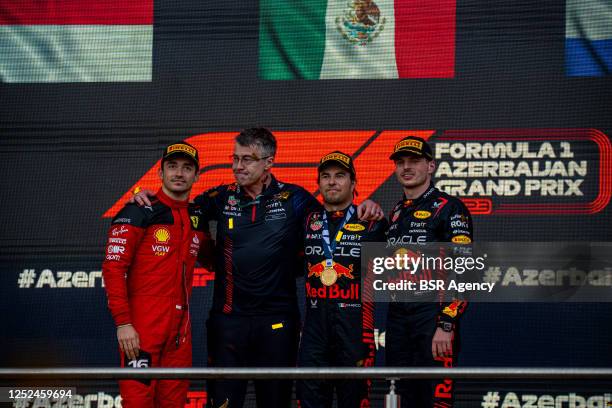 Charles Leclerc of Ferrari and Monaco, Sergio Perez, Red Bull Racing RB19 and Max Verstappen of Red Bull and the Netherlands during the podium...