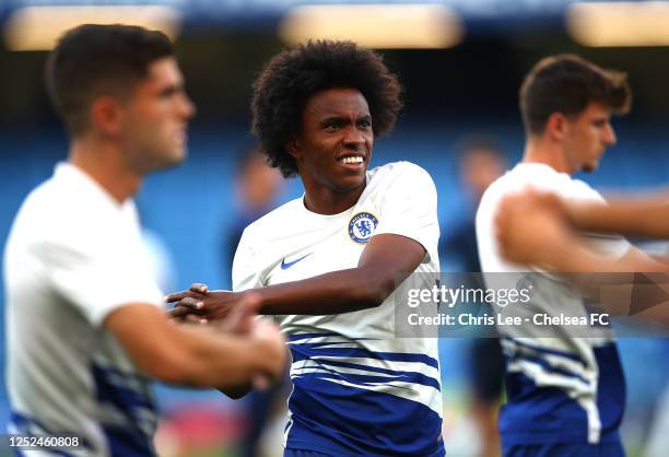 Willian of Chelsea warms up prior to the Premier League match between Chelsea FC and Manchester City at Stamford Bridge on June 25, 2020 in London,...