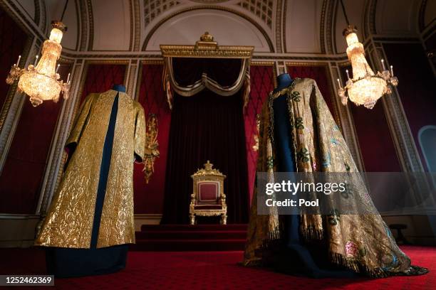 The Coronation Vestments, comprising of the Supertunica and the Imperial Mantle , displayed in the Throne Room at Buckingham Palace on May 1, 2023 in...