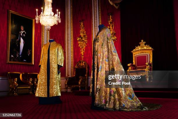 The Coronation Vestments, comprising of the Supertunica and the Imperial Mantle , displayed in the Throne Room at Buckingham Palace on May 1, 2023 in...