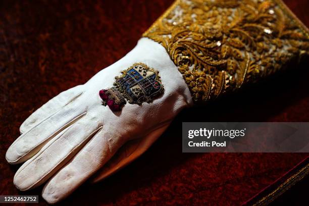 The Coronation Gauntlet glove, which forms part of the Coronation Vestments, is displayed in the Throne Room at Buckingham Palace on May 1, 2023 in...