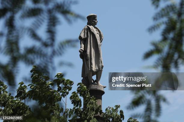 Statue to the famed explorer Christopher Columbus stands in Columbus Circle June 25, 2020 in New York City. As states across the United States take...