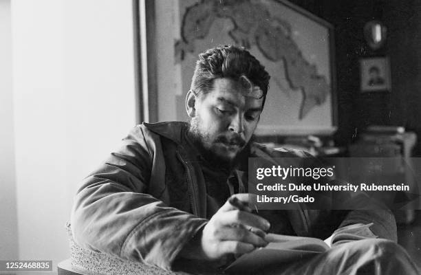 Portrait of revolutionary leader Comandante Ernesto Che Guevara, aka "Che Guevara", in his office, Cuba, 1963. From the Deena Stryker photographs...