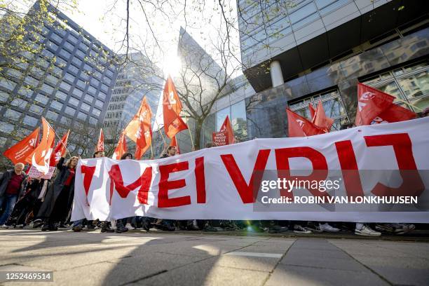 Sympathizers take part in an action march on Labour Day to protest against inequality, workload and high prices, in Amsterdam, on May 1, 2023. /...