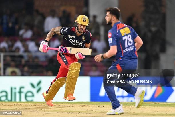 Royal Challengers Bangalore's Faf du Plessis runs between the wickets during the Indian Premier League Twenty20 cricket match between Lucknow Super...