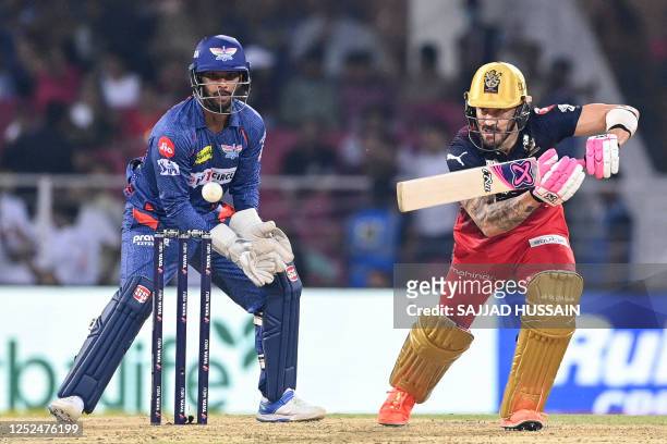 Royal Challengers Bangalore's Faf du Plessis plays a shot during the Indian Premier League Twenty20 cricket match between Lucknow Super Giants and...