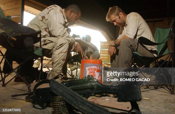 Army soldier Specialist Anthony Woods from the 1st Combat Brigade Team engages Julian Morris , a television journalist from Skynews, England, in a...