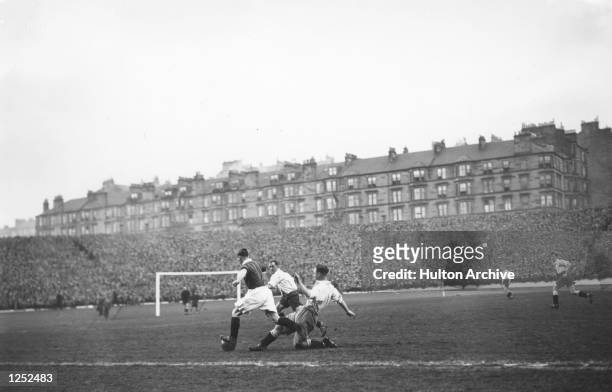 Morgan of Scotland beats two English defenders during the Home Championship match at Hampden Park, Glasgow. The game finished in a 2-2 draw with...