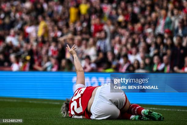 Arsenal's Austria defender Laura Wienroither reacts and lays down following an injury during the UEFA Women's Champions League semi-final second-leg...