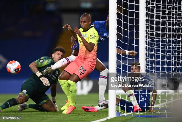 Fernandinho of Manchester City blocks the ball with his hand resulting in a red card during the Premier League match between Chelsea FC and...