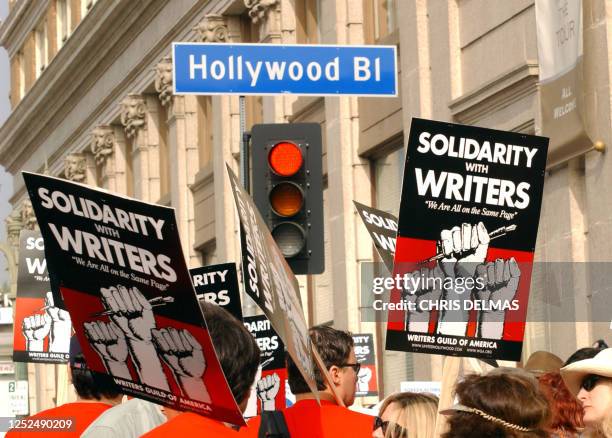 This November 20, 2007 photo shows demonstrators holding signs during the 20072008 Writers Guild of America strike in Hollywood. Hollywood faced a...