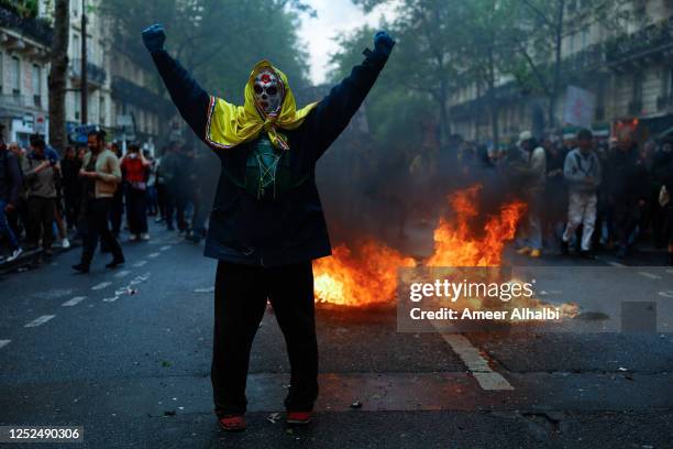 People demonstrate on the streets as this year's May Day protests coincide with weeks of public outrage over a pension-reform law that increased the...