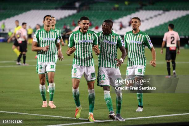 Marc Bartra of Real Betis celebrates scoring his teams first goal of the game with team mates during the Liga match between Real Betis Balompie and...