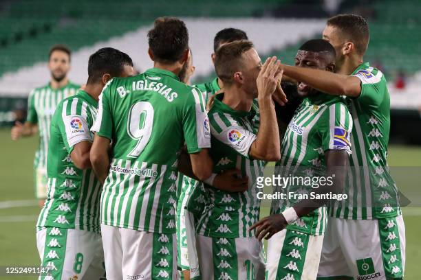 Marc Bartra of Real Betis celebrates scoring his teams first goal of the game with team mates during the Liga match between Real Betis Balompie and...