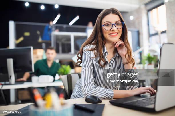 young business woman at her workplace - project manager stock pictures, royalty-free photos & images