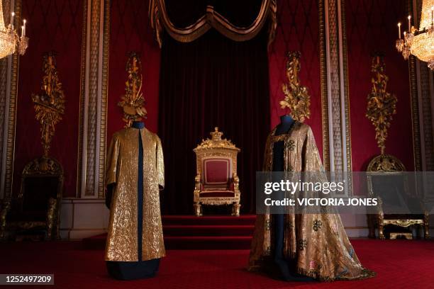 The Coronation Vestments, comprising of the Supertunica and the Imperial Mantle are displayed in the Throne Room at Buckingham Palace in London on...